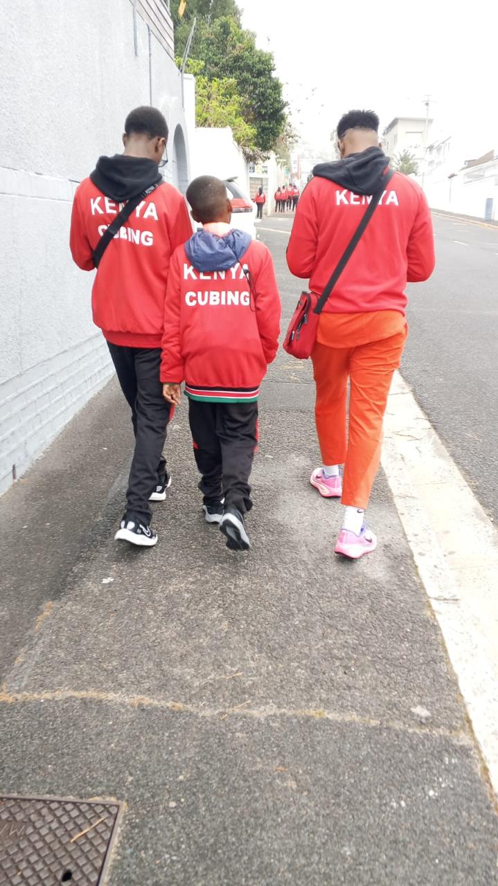 Kenya team members wearing competition shirts together on a field