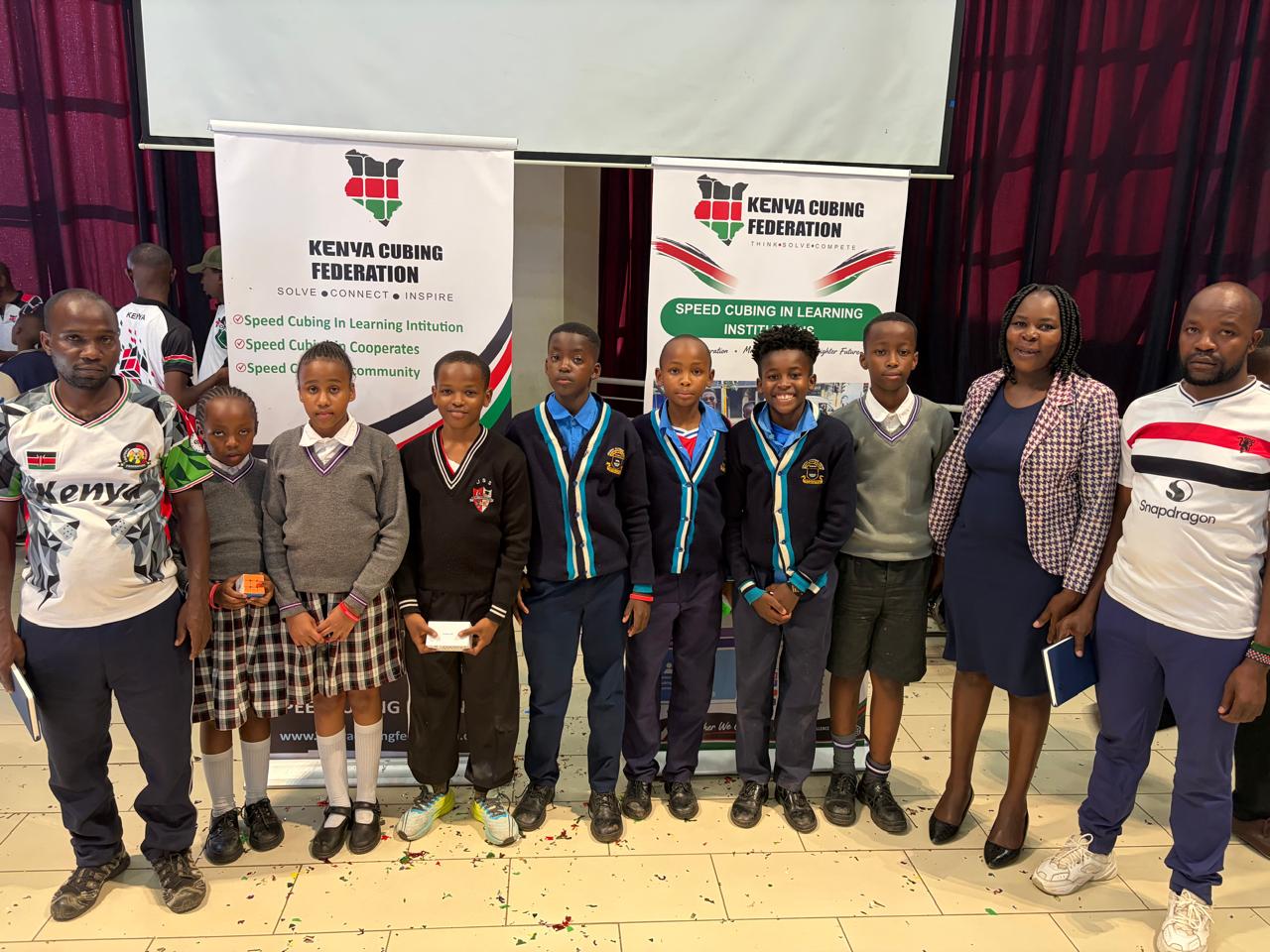 School students and Kenya Cubing Federation members at a community event